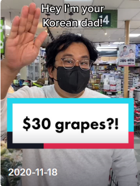 Your Korean Dad short screenshot of him waving in a grocery store with the words $30 grapes?! 