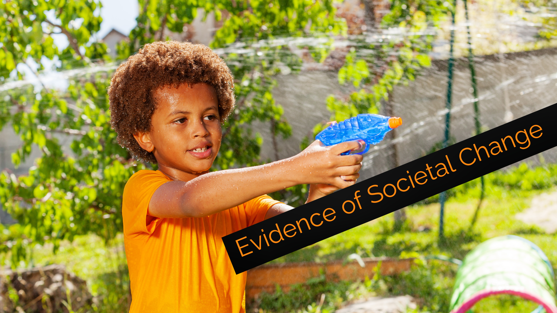 Young African American child is outside during a water gun battle, pointing a plastic water gun, ready to pull the trigger. The overlaid title says, "Evidence of Societal Change."