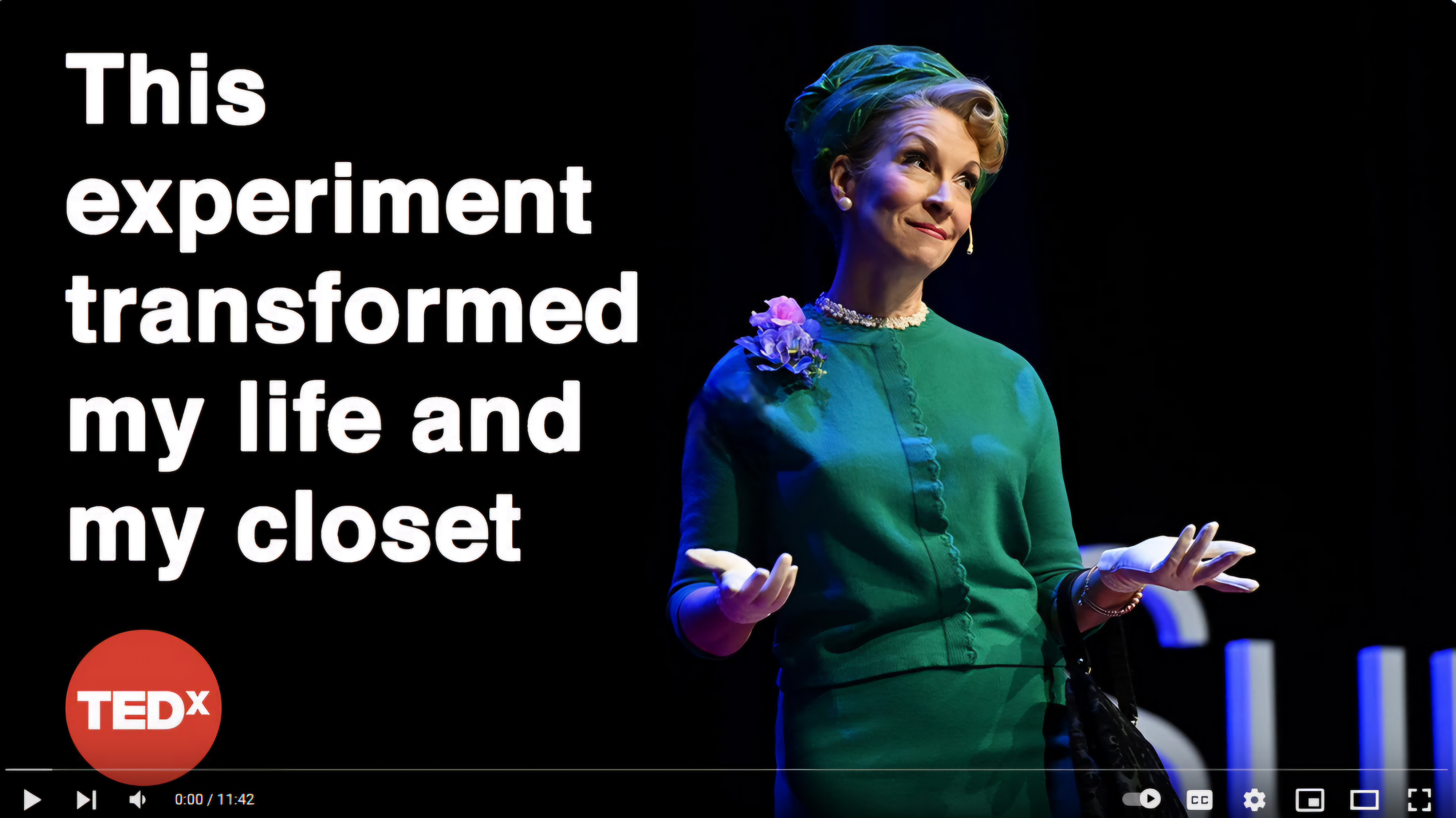 Screenshot of Mollie Kaye's TEDx talk titled "This experiment transformed my life and my closet." Mollie is seen on stage dressed in a 1950 era, green outfit with hat, flower, and white gloves.