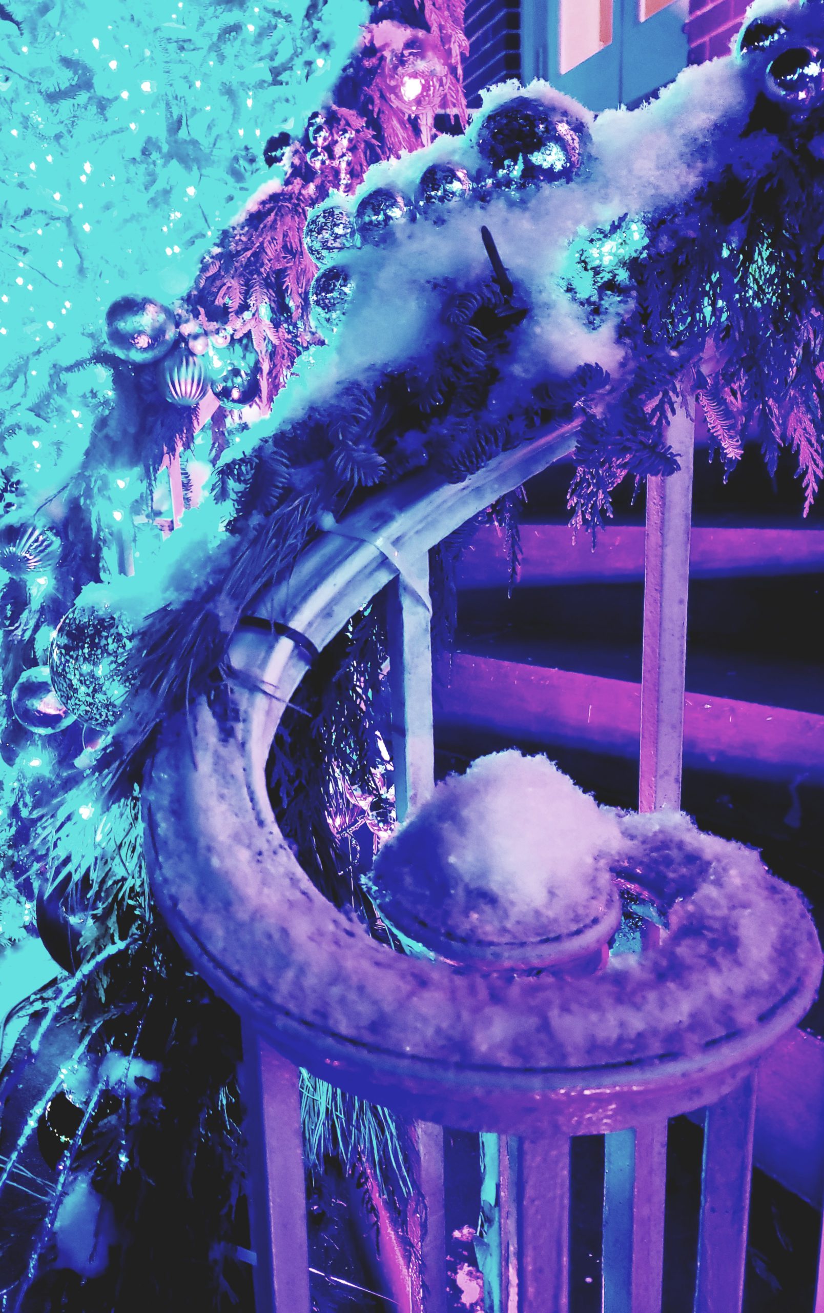 Handrail with garland covered snow